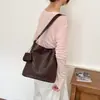 Bolso de Gran Capacidad con Textura Tejida para Mujer 2026 Nuevo Bolso Cubo Pequeño de Nicho de Gama Alta Bolso Cruzado Trendy Casual para el Trabajo