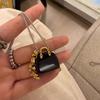 Estilo coreano doce estilo legal bolsa de obsidiana de olho de tigre colar de corda de uva design de nicho colar de corrente de suéter combinando