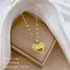 [Acero de titanio] Collar elegante y hermoso de lujo con forma de corazón hueco, cadena de clavícula de acero de titanio para mujer.