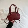Bolso de mano minimalista y único de estilo coreano retro, un nuevo bolso de hombro y bolso cruzado tipo almohada de moda para mujer