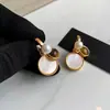 Pendientes de Flor de Ojo de Tigre Color Café Transfronterizos Europeos y Americanos, Aretes de Moda y Únicos, Pendientes de Lujo Ligero y de Alta Gama al por Mayor