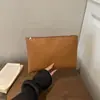 Bolsa de trabalho para o dia a dia de cor sólida 2026 PU com padrão trançado cor sólida moderna texturizada casual grande capacidade envelope clutch bag