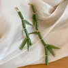 Pendientes de borla de flor de cuentas de color dopamina para primavera, sensación de lujo ligero y alta gama, pendientes atmosféricos estilo vacacional para mujer