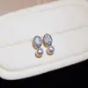 Pendientes de botón pequeños de perla ovalada con mini circonita de aguja plateada, pendientes de diseño exquisito de nicho, pendientes de moda francesa suaves