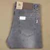 Pantalones Elásticos Grises de Fibra de Poliéster Delgada Moda Primavera y Verano Jeans Blancos Rectos de Cintura Media para Hombre
