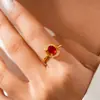 Anillo Abierto de Zirconia Roja Ovalada Electrochapado en Oro Real de 24 Quilates Anillo Transfronterizo Europeo y Americano Lujo Accesible Joyería de Alta Gama