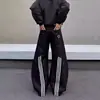 Jeans de estilo retrô americano com patchwork de respingos de tinta, três listras e barra curva, calça unissex larga e solta com um design único