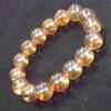Pulsera de cristal de imitación dorado de 12 mm exquisita joyería al por mayor pulsera de tienda de dos yuanes pulsera de citrino ámbar dorado