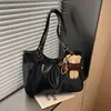 Bolso de hombro minimalista estilo coreano, bolso tote retro, bolso de mano de moda y versátil para el trabajo, nuevo para el otoño de 2026, transfronterizo