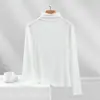 Camiseta de manga larga básica ajustada para mujer que realza la figura, de canalé, color liso, cuello alto, top fino versátil para primavera y otoño