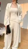 Conjunto casual de punto de tres piezas estilo francés para mujer, nuevo otoño e invierno holgado, casual, moderno, conjunto de cárdigan con tirantes y pantalones de pierna ancha