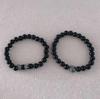 Venta caliente transfronteriza nueva 8 mm piedra negra esmerilada cabeza de leopardo dorada antigua plata cabeza de león pulsera elástica para hombres y mujeres venta al por mayor