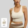 Top de tirantes de yoga para mujer en color melocotón, con diseño de retazos y copas extraíbles, con un hermoso diseño en la espalda, adecuado para fitness y deportes, y que ofrece absorción de impactos