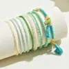 Pulsera apilada de cuentas de semillas con colgante de borla de cuentas bohemia más vendida transfronteriza con un diseño geométrico de alta gama