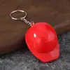 Venta directa de fábrica casco de seguridad colorido llavero abridor de cerveza abridor de botellas de plástico mercancía práctica exquisita creativa única