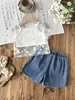 Conjunto de Tres Piezas para Niñas Primavera/Verano 2026 Europeo y Americano Transfronterizo: Blusa Hueca de Color Sólido + Camisola + Jeans con Estampado de Girasol