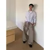 Camisa longa listrada color block minimalista estilo americano 2025 para homens e mulheres, com design de alta qualidade, corte solto, camisa cardigã versátil
