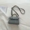 2026 Nueva Moda Trendy Bolso con Hebilla de Cierre Texturizada Estilo Ins Bolso Pequeño Cuadrado para Mujer Primavera y Verano Bolso Cruzado Artístico Elegante