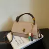 Bolso de nicho minimalista de moda transfronterizo, bolso cruzado nuevo vintage otoño 2026, versión coreana bolso cuadrado pequeño de mano simple