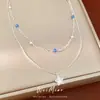 Collar de cuentas de piedra de doble capa con estrellas de circonita y perlas, cadena para la clavícula de nicho de lujo ligero, accesorio elegante y versátil para el día a día