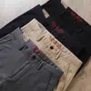 Estación Europea Otoño e Invierno Pantalones Cálidos Gruesos con Forro de Polar Elásticos para Hombre Grises de Negocios Engrosados Rectos Casuales