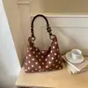 Bandolera de un solo hombro 2026 popular exquisita súper caliente nuevo estilo para ir al trabajo temperamento coreano nicho bolso bolso de moda mujer