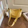 Nova bolsa casual retrô de outono de 2026, grande capacidade para mulheres, bolsa tipo bolinho de cor sólida, bolsa de ombro e transversal simples para o dia a dia