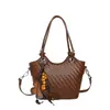Bolso pequeño de moda de verano para mujer, nuevo estilo 2026, bolso tipo cubo con patrón tejido simple, bolso de hombro y bolso cruzado versátil