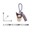 Madera de Haya Natural Talla Kuromi Incrustado con Ébano Negro Colgante Llavero Decoración para Bolso Artesanías de Madera al por Mayor