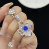 Anillo, collar y pendientes elegantes de alta calidad con microincrustaciones de circón azul de doble flor de nicho retro europeo y americano de Sri Lanka