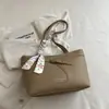2026 Verano Nuevo Bolso Tote de Gran Capacidad para Viajes Cotidianos Estilo Coreano Simple Estilo Ins Bolso de Mano Cruzado al por Mayor Bolso para Mujer
