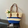 Bolsa tejida de estilo nuevo para la primavera de 2026, bolsa de playa de paja, de un solo hombro, estilo vacacional pastoral francés, bolsa grande para mujer
