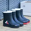 Botas de lluvia transfronterizas, unisex, altura media hasta la pantorrilla, antideslizantes, impermeables, con puños elásticos, adecuadas para el trabajo, venta al por mayor, versátiles, antideslizantes y duraderas