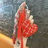 Chaveiro de franja em formato de coração xadrez estilo Chanel transfronteiriço, pingente fofo para bolsa, chaveiro de presente pequeno, atacado de comércio exterior