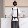 Delantal moderno impermeable y a prueba de aceite de PU lavable para cocina casera, delantal de cocina modelo nuevo, ropa de trabajo especializada para catering con texto impreso