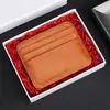 Portatarjetas de Piel Genuina Bolsa para Identificación Capa Superior Anti-magnética Logo de Piel de Vaca En stock Ultradelgado Múltiples Tarjetas Bolsa para Tarjetas Transfronteriza para Hombres y Mujeres