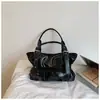 Bolso grande de mujer simple transfronterizo 2026 nuevo bolso de hombro para el trabajo bolso de mano para primavera y verano bolso tote bolso de axila