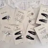 Grampo de cabelo infantil com design de bolinhas onduladas preto e branco e flor de cerejeira, presilha lateral, clip BB