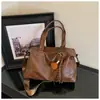 Bolsa de Hombro Individual de Gran Capacidad para Comercio Exterior para Mujer 2026 Nuevo Otoño Invierno Versátil Bolsa Tote Simple para el Trabajo Manual Cruzada