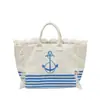Bolso de lona con letra y borla minimalista para comercio exterior, bolso de mano de gran capacidad, nuevo bolso tote de hombro de color liso para uso transfronterizo