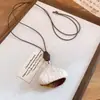 Cordón de cuero cuentas de resina madera corazón de cuentas redondas collar estilo étnico cadena para suéter de nicho joyería de moda china nueva para mujer
