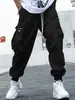 Calça Cargo Plus Size 2023 Primavera Estilo Japonês Marca Tendência Calças Casuais Masculinas Calças com Múltiplos Bolsos de Aba Tendência Jovem Perna Larga Solta com Elástico