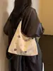 Bolsa de Lona Bordada Cartoon Casual Feminina 2026 Nova Bolsa Tote de Grande Capacidade Versátil para o Dia a Dia Bolsa de Ombro Único