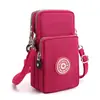 Bolsa transversal para celular estilo coreano transfronteiriça feminina de tecido bolsa para celular com alça de pescoço bolsa de braço esportiva carteira de moedas de pulso vertical