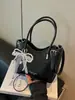 Bolso de cubo tejido de nicho transfronterizo 2026 nuevo bolso de cesta de moda para mujer bolso de mano simple para hombro cruzado