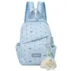 Mochila nueva de primavera, rosa y delicada, con un aire juvenil, alto atractivo estético, adecuada para chicas de secundaria, con lunares y un lazo, bolso versátil de doble hombro