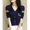 Camiseta de manga corta para mujer Shenzhen Nanyou, estilo boutique, estampado de perro con pedrería, bloques de color, nuevo estilo de verano, elegante top de punto con cuello en V