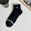Calcetines de mujer primavera/verano delgados combinables calcetines cortos japoneses dulces estilo Chanel camelia blanco y negro amor estilo universitario calcetines cortos