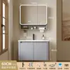 Tocador de baño engrosado y ahorrador de espacio con diseño en color crema, que cuenta con un lavabo redondeado, lavabo cerámico integrado y un lavabo de una sola pieza.