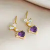 Pendientes de Cobre Dorado con Circonitas en Forma de Corazón Brillantes Blancos y Morados para Mujer 2026 Nuevo Estilo Pendientes de Alta Gama Pendientes Únicos y Hermosos